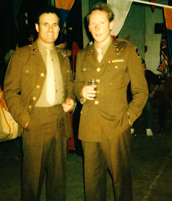 sean glenn acting in how we use to live dressed in full sixties issue faen coloured army clothing with one hand in his left trouser pocket