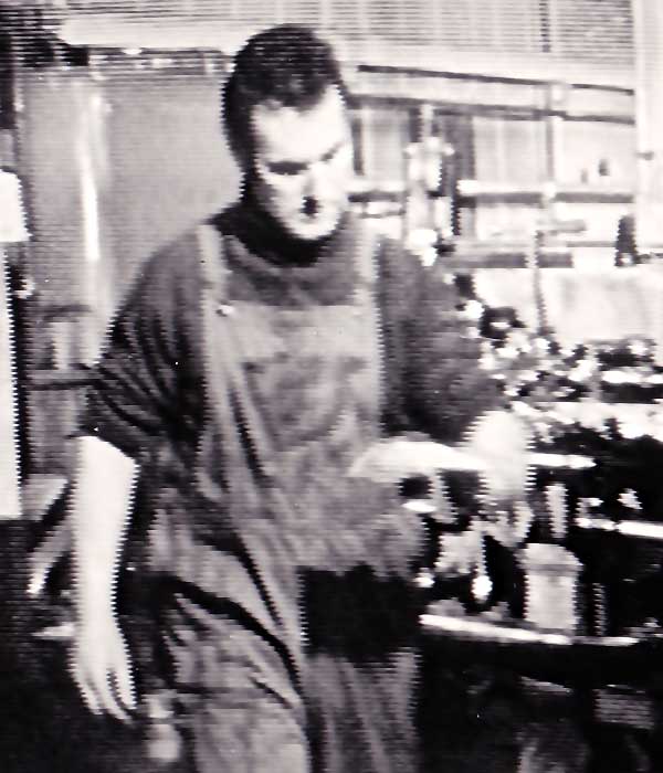 City 68 (2) TV close up of sheffield actor sean glenn in machine engineering clothing including pocketed dungarees working in a machine shop
