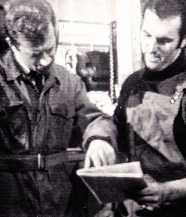 City 68 (3) TV glenn acting his socks off with fellow acting discussing factory issues both smartly dressed in machine shop clothing